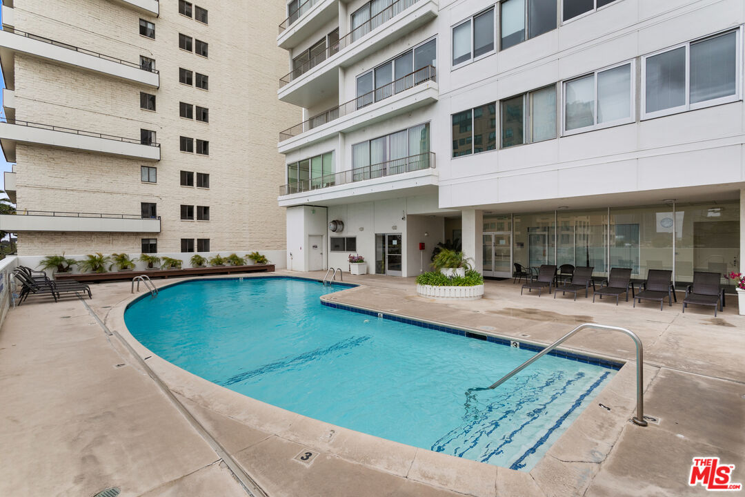 10501 Wilshire Boulevard, Unit 1605 Los Angeles, CA 90024 - Photo 3 of 27 a view of a swimming pool with a patio