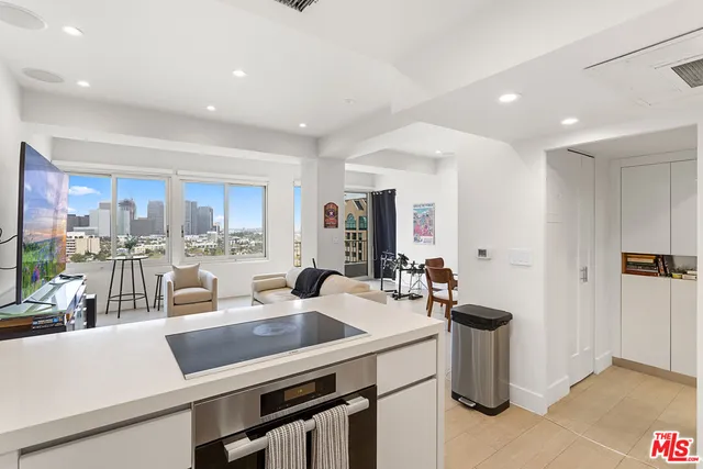 a kitchen with a sink appliances and cabinets