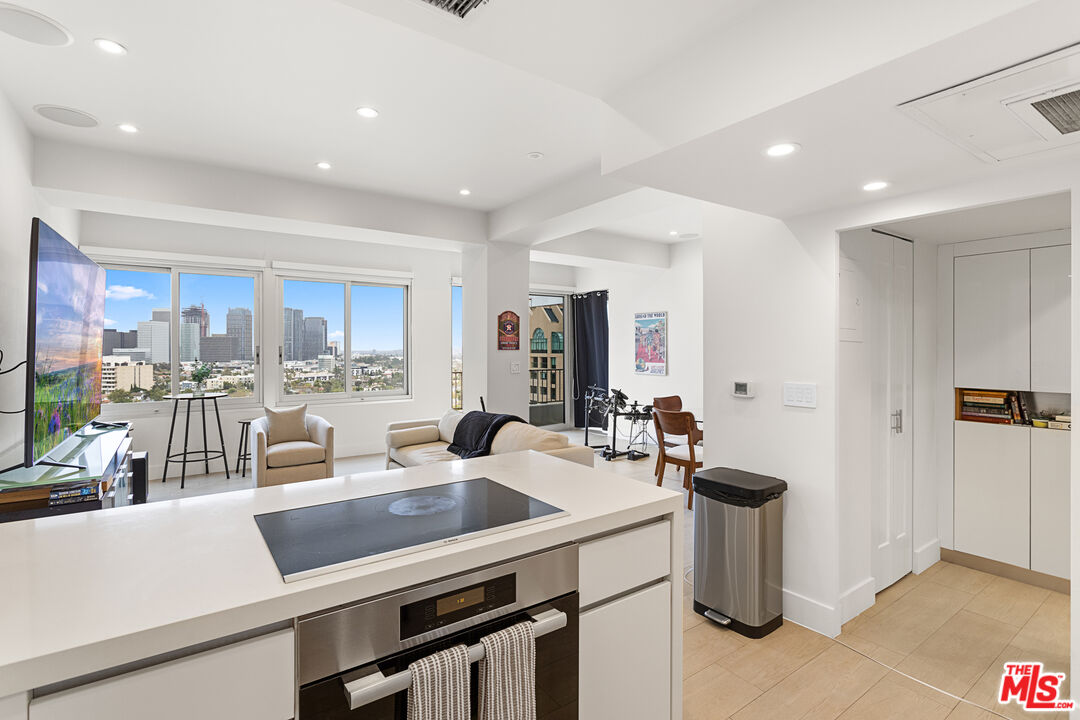 10501 Wilshire Boulevard, Unit 1605 Los Angeles, CA 90024 - Photo 6 of 27 a kitchen with a sink appliances and cabinets