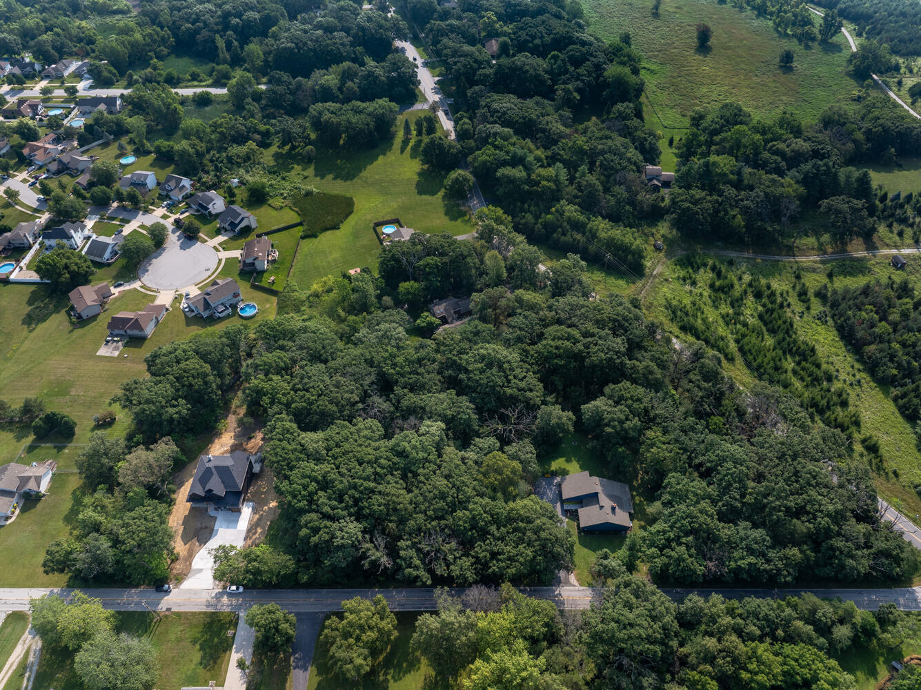 6308 West 91st Avenue Crown Point, IN 46307 - Photo 13 of 16 an aerial view of residential house with outdoor space and trees all around
