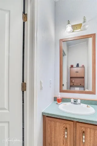 a bathroom with a sink and a mirror