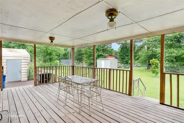 a view of a balcony with wooden floor