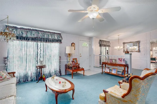 a room with furniture and a chandelier