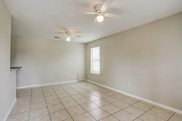 a view of an empty room with a window