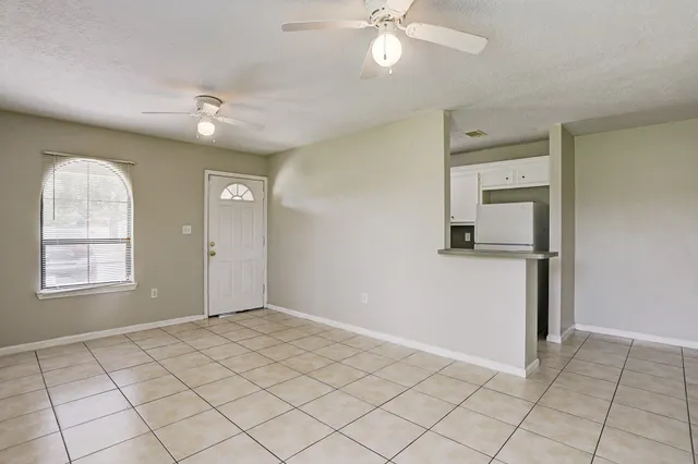 a view of an empty room and window