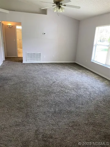 a kitchen with stainless steel appliances a stove a sink and white cabinets