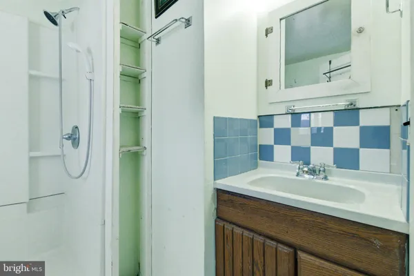 a bathroom with a shower and toilet