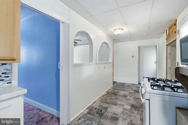 a view of a kitchen with refrigerator and stove