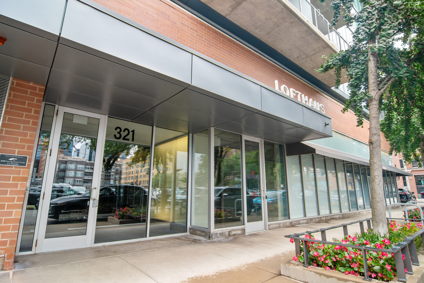321 South Sangamon Street, Unit 501 Chicago, IL 60607 - Photo 1 of 11 a front view of a building with glass door
