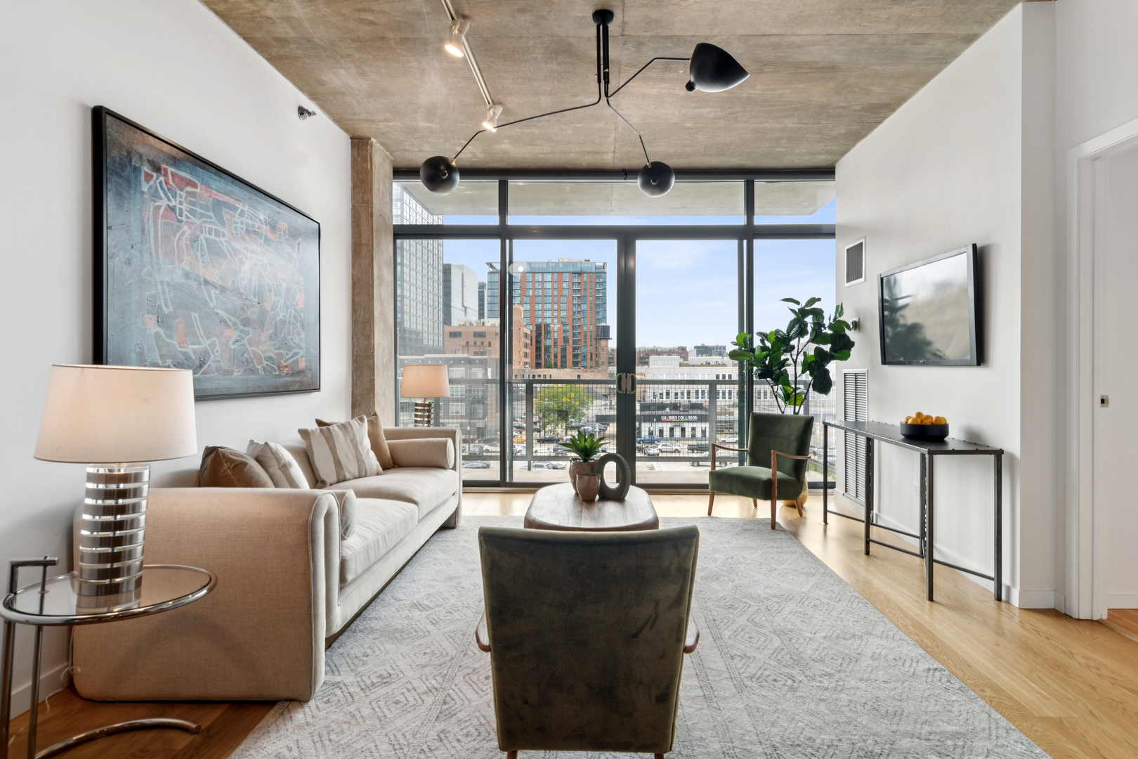 321 South Sangamon Street, Unit 501 Chicago, IL 60607 - Photo 3 of 11 a living room with furniture and a large window