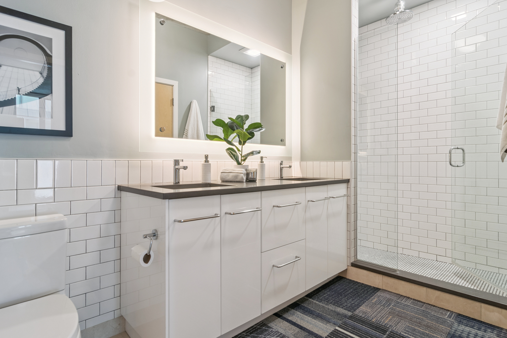 321 South Sangamon Street, Unit 501 Chicago, IL 60607 - Photo 8 of 11 a bathroom with a sink a toilet and mirror