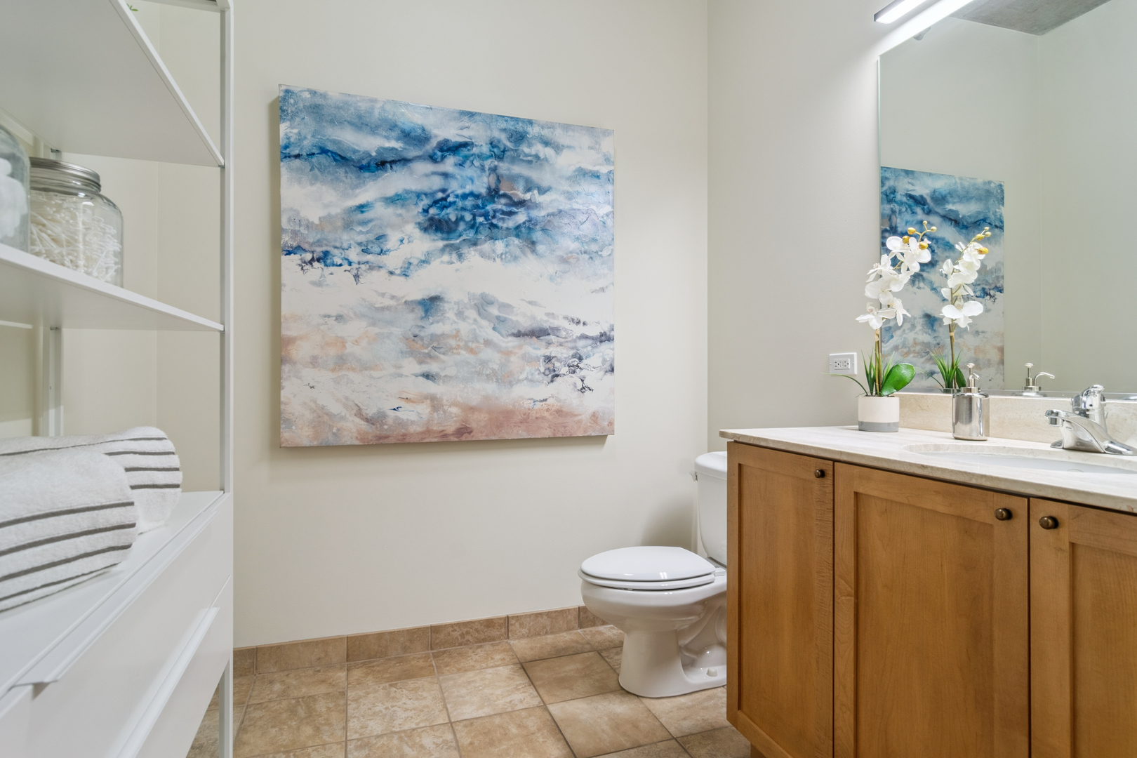 321 South Sangamon Street, Unit 501 Chicago, IL 60607 - Photo 10 of 11 a bathroom with a toilet sink and vanity