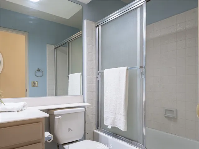 a bathroom with a shower and a toilet