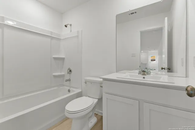 a bathroom with a sink a toilet and a bathtub