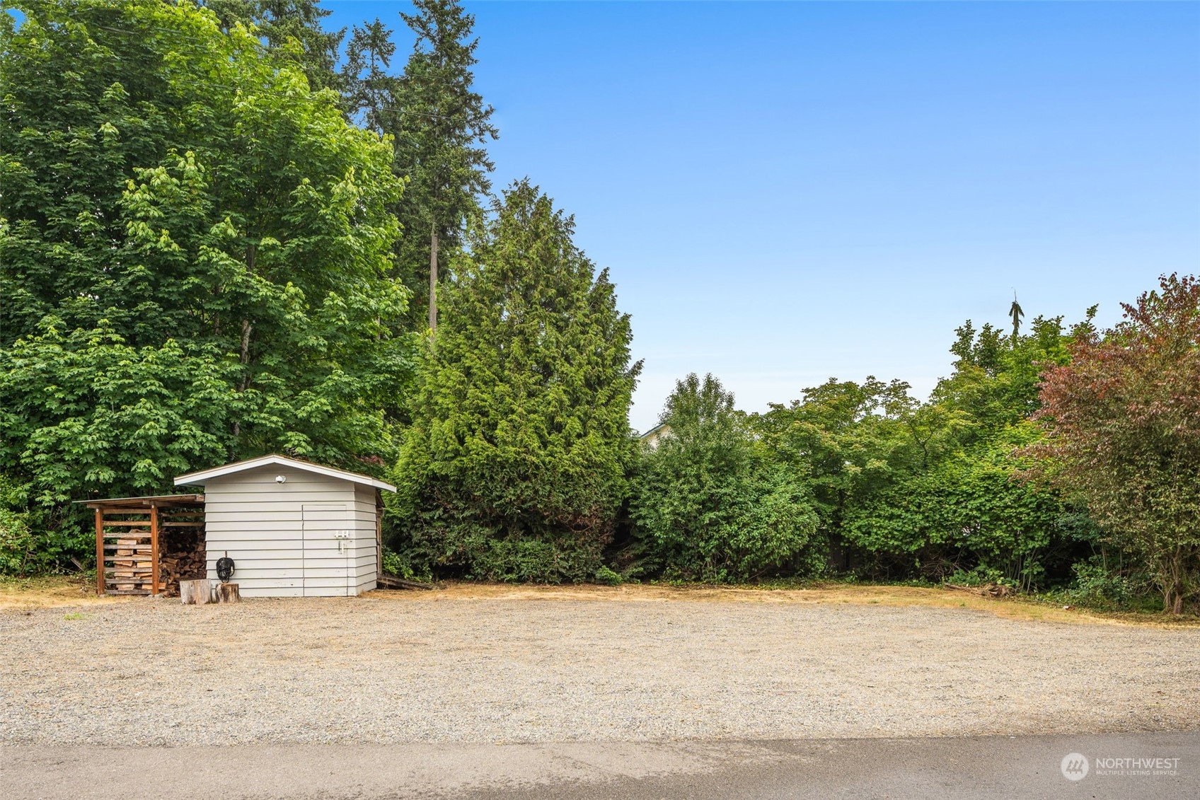 829 Harvest Road Bothell, WA 98012 - Photo 29 of 34 a backyard of a house with lots of green space