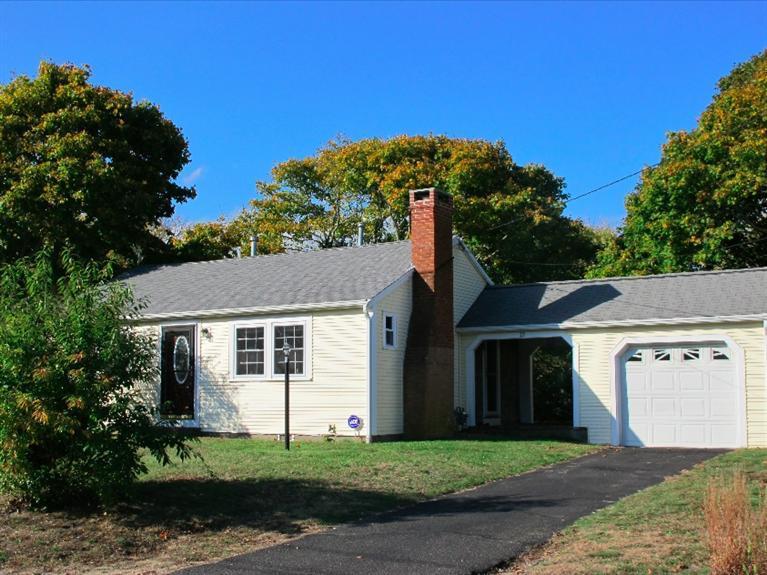 12 Iyanough Road Hyannis, MA 02601 - Photo 1 of 35 a view of a white house with a small yard and a large tree