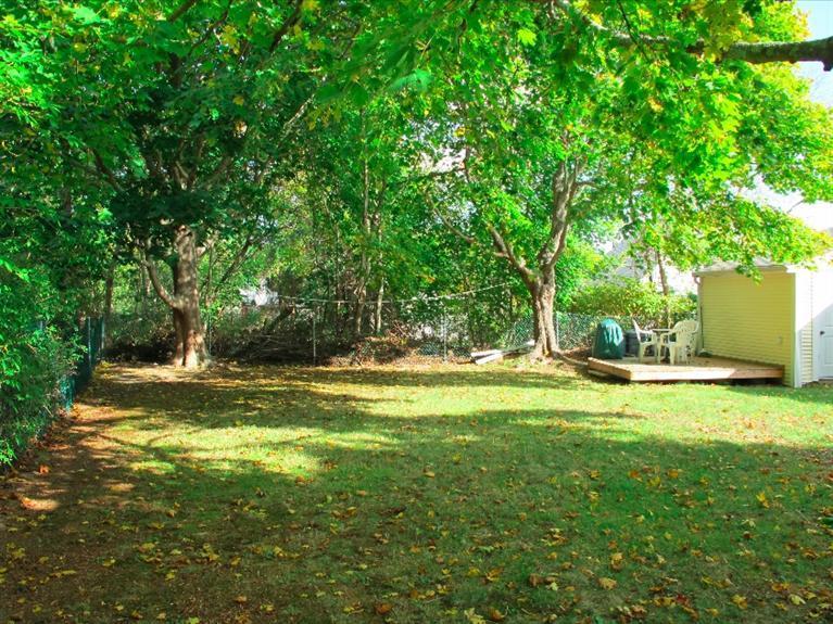 12 Iyanough Road Hyannis, MA 02601 - Photo 17 of 35 a view of a yard with a tree