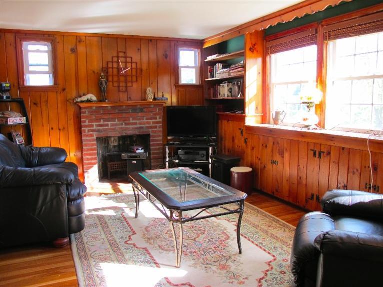 12 Iyanough Road Hyannis, MA 02601 - Photo 4 of 35 a living room with furniture a fireplace and a large window