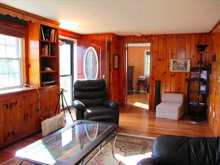 12 Iyanough Road Hyannis, MA 02601 - Photo 6 of 35 a living room with furniture a lamp wooden floor and a large window