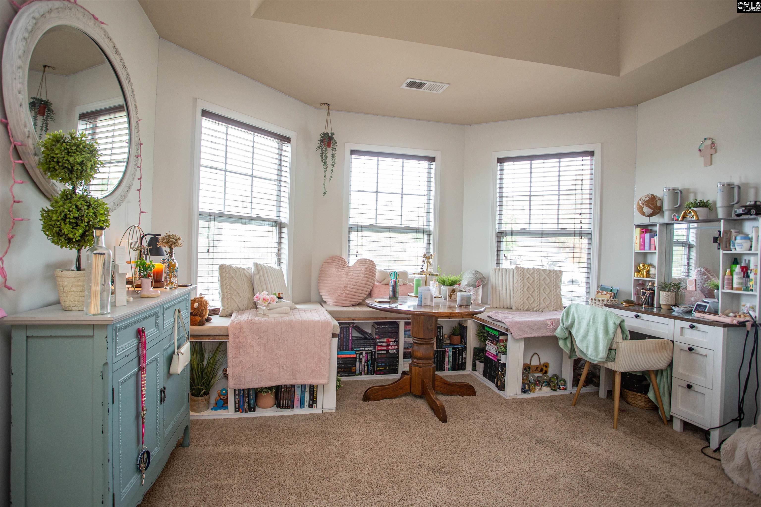 7 Templand Court Elgin, SC 29045 - Photo 44 of 47 a room with furniture a large window and a table chair