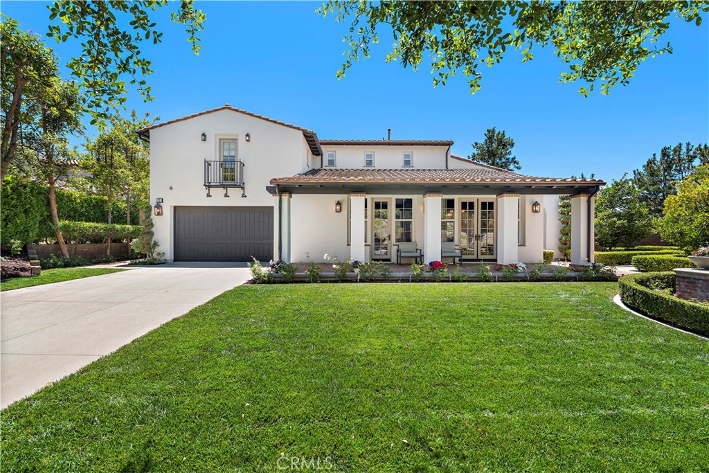 a front view of house with yard and trees