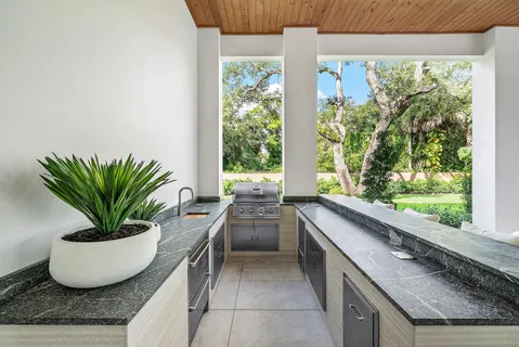 a bathroom with a glass shower door and a bathtub