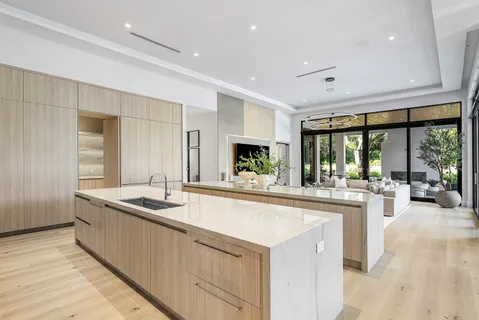 a bedroom with bed and glass window
