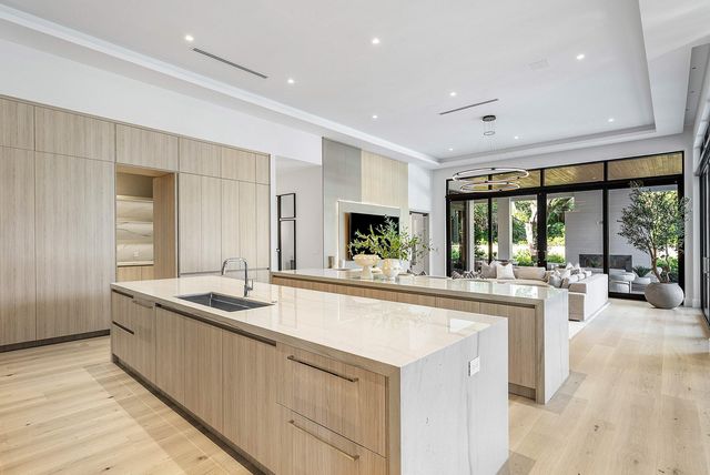 a bedroom with bed and glass window