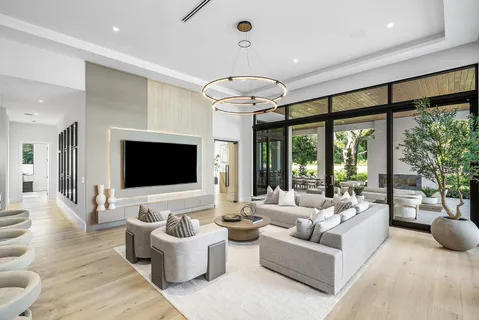 a bathroom with a double vanity sink toilet and shower