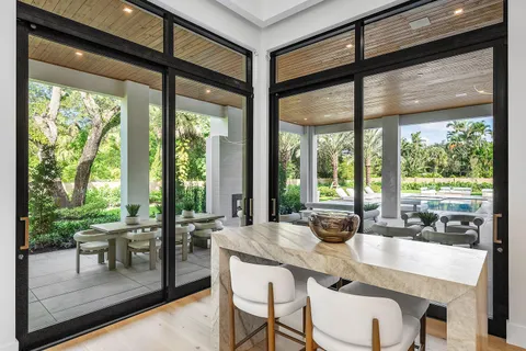 an aerial view of a house with a yard basket ball court and outdoor seating