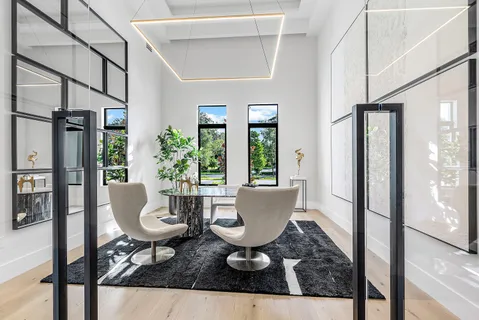 a lobby with furniture and a large window
