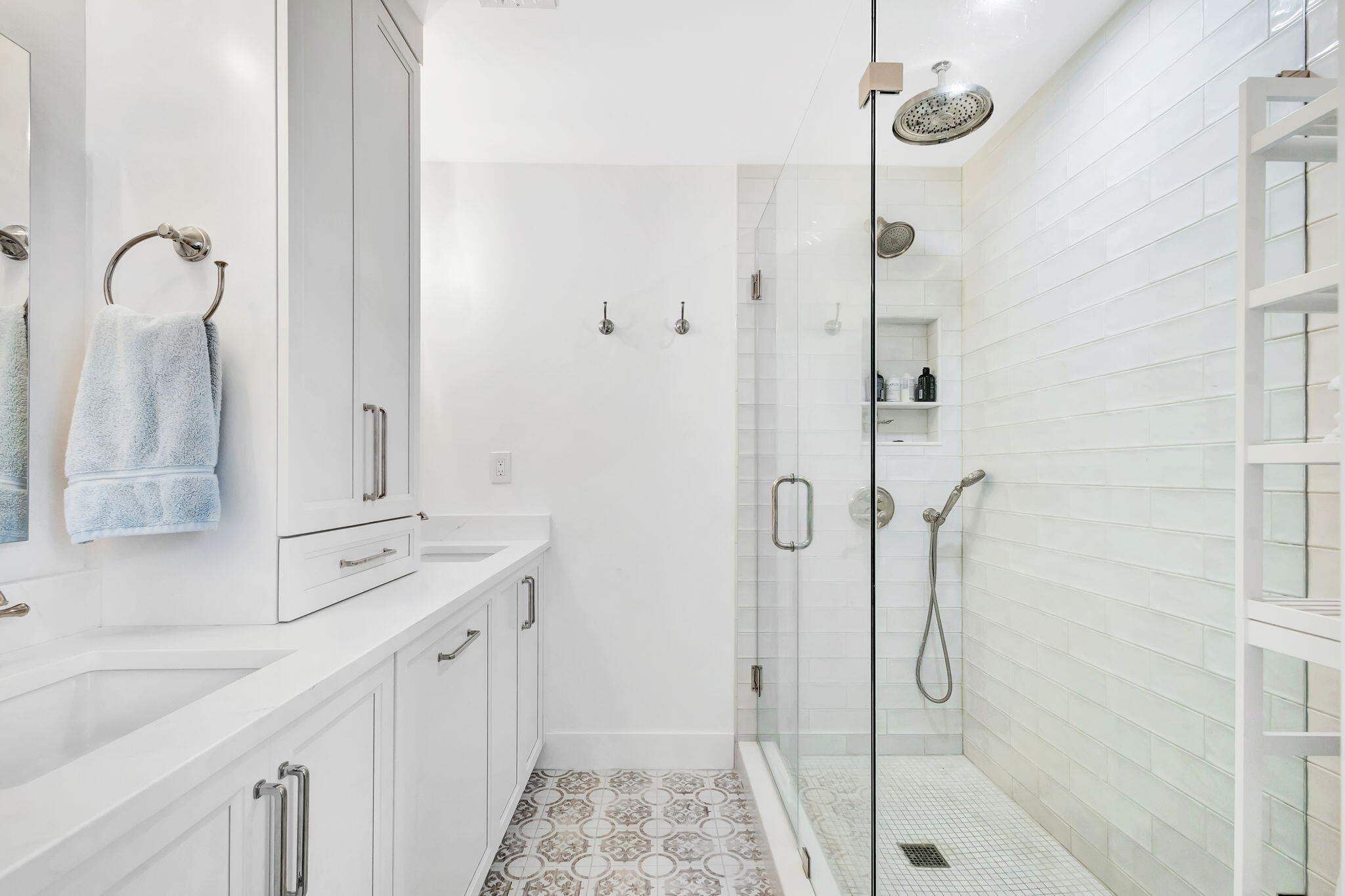 240 Celestial Way, Unit 5 Juno Beach, FL 33408 - Photo 13 of 41 a bathroom with a double vanity sink a mirror and shower