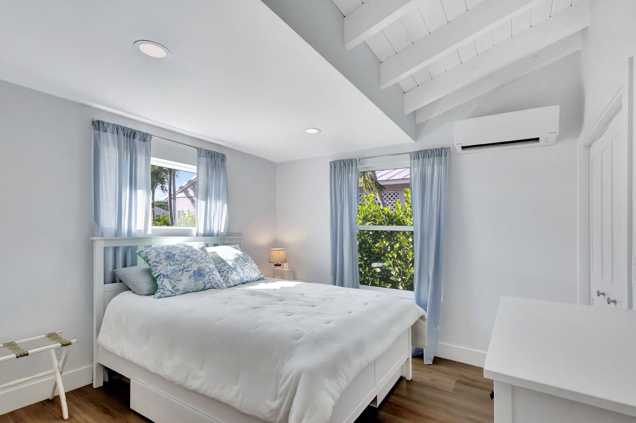 240 Celestial Way, Unit 5 Juno Beach, FL 33408 - Photo 17 of 41 a bedroom with a bed and a window