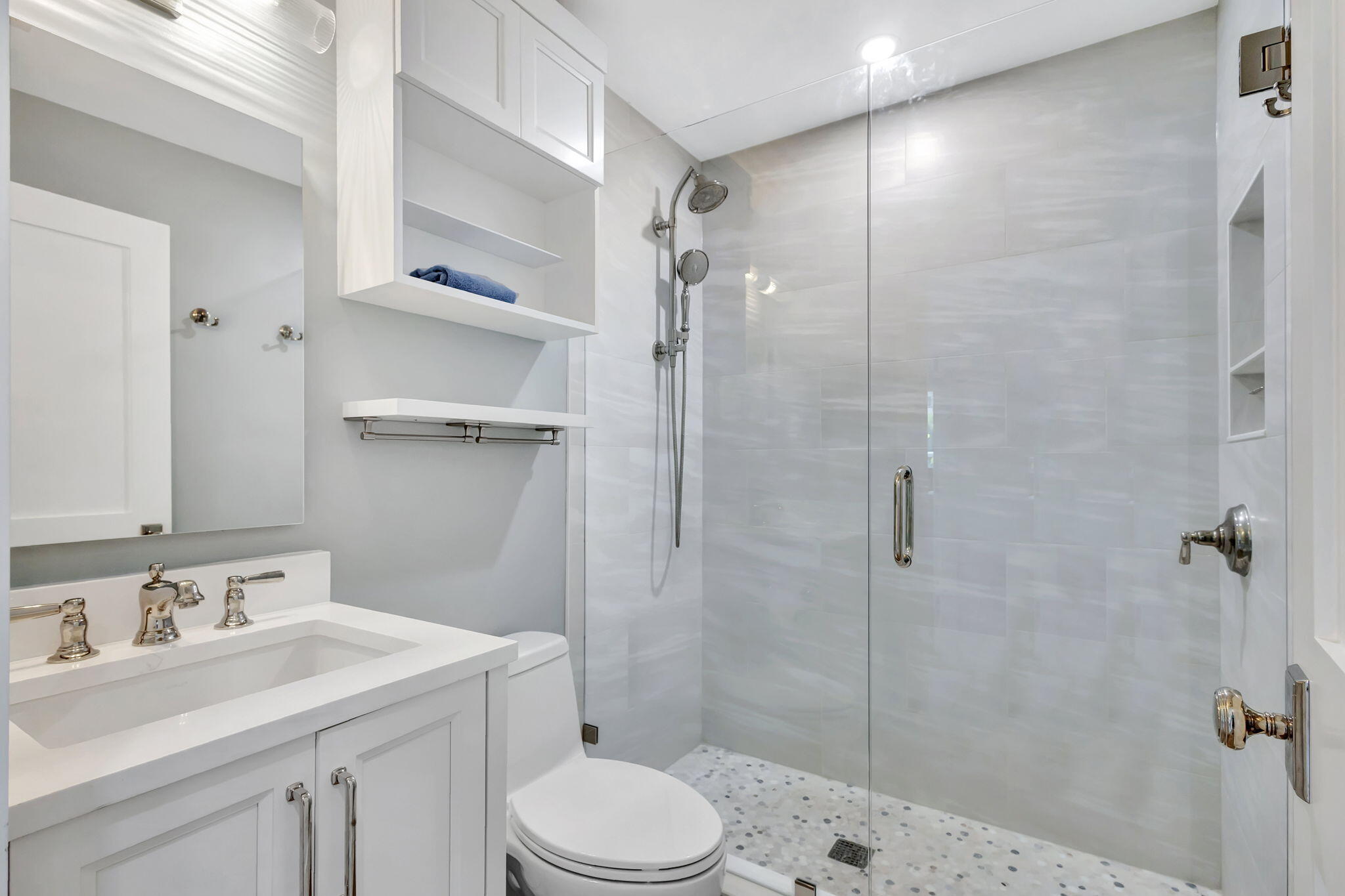 240 Celestial Way, Unit 5 Juno Beach, FL 33408 - Photo 18 of 41 a bathroom with a sink toilet and shower