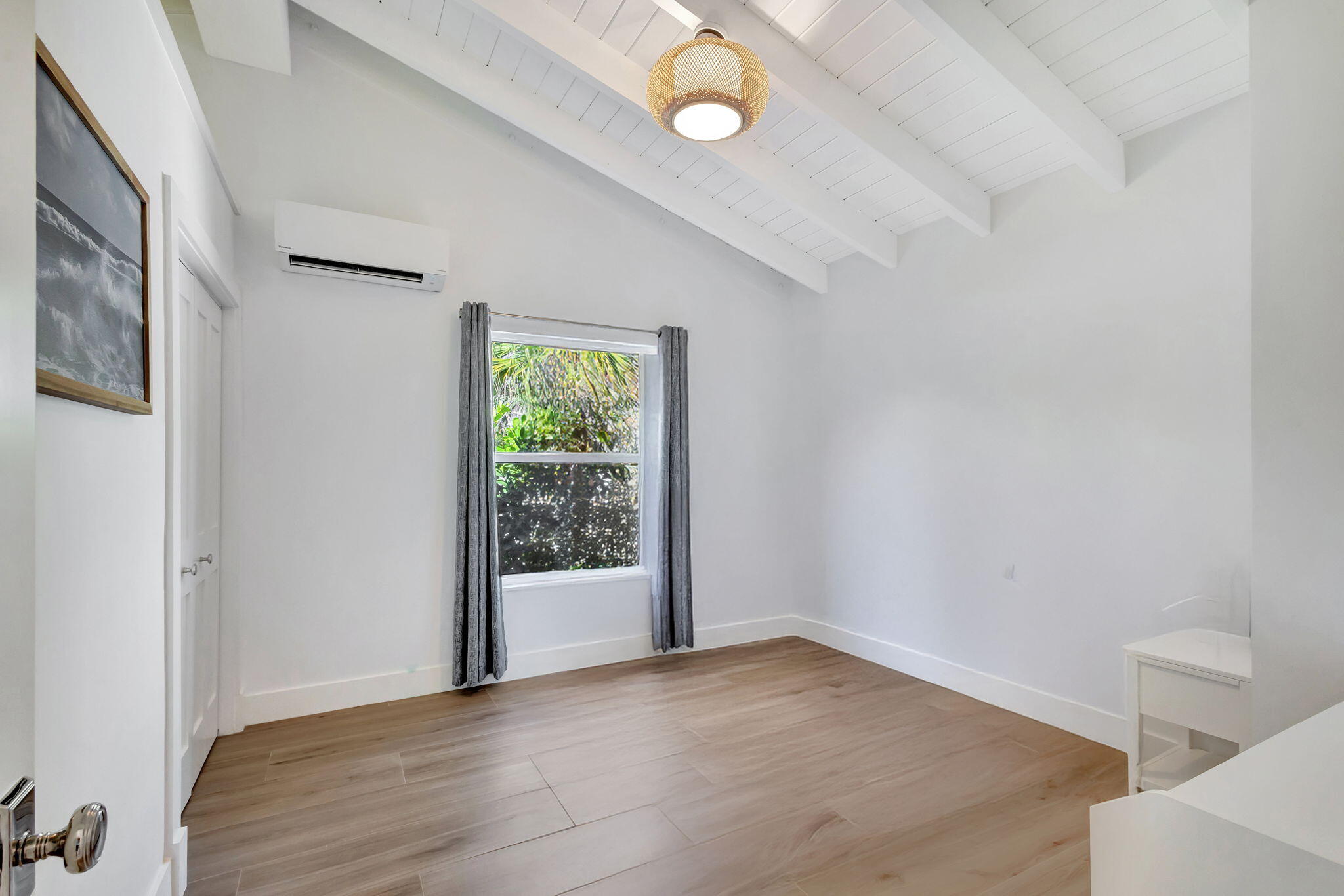 240 Celestial Way, Unit 5 Juno Beach, FL 33408 - Photo 19 of 41 an empty room with windows and entrance