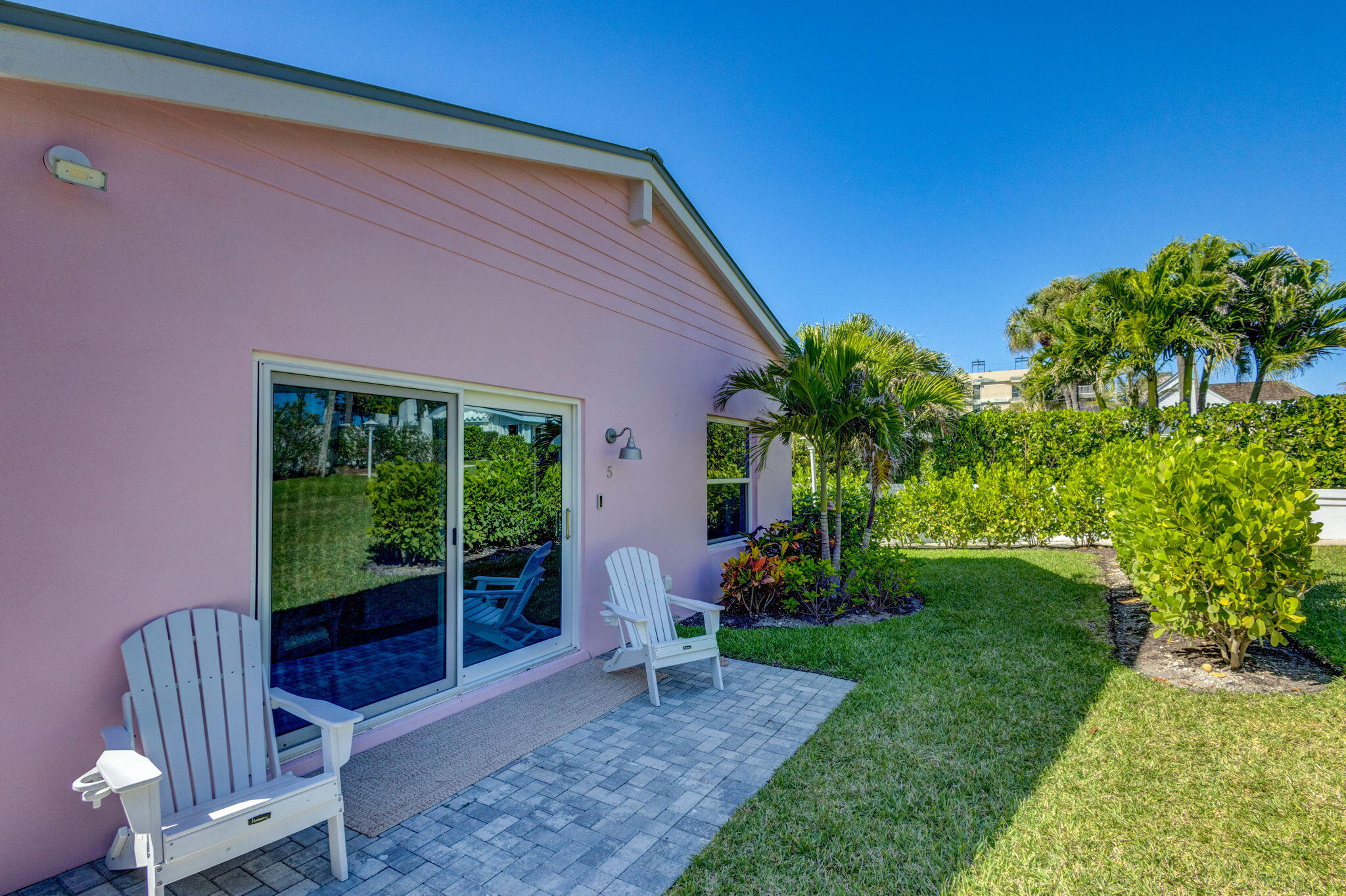 240 Celestial Way, Unit 5 Juno Beach, FL 33408 - Photo 21 of 41 a house view with a garden space