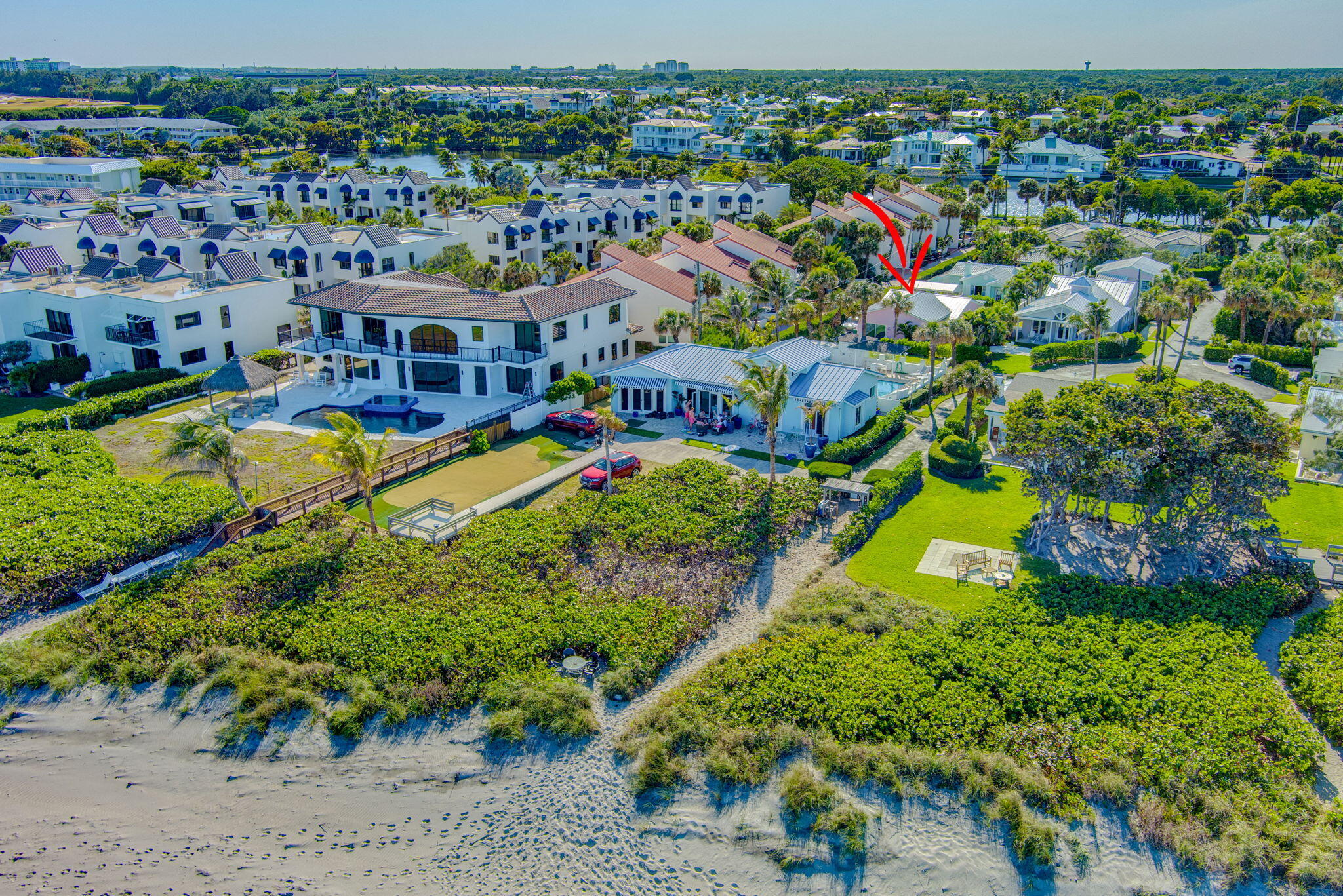 240 Celestial Way, Unit 5 Juno Beach, FL 33408 - Photo 32 of 41 an aerial view of residential houses with outdoor space and swimming pool