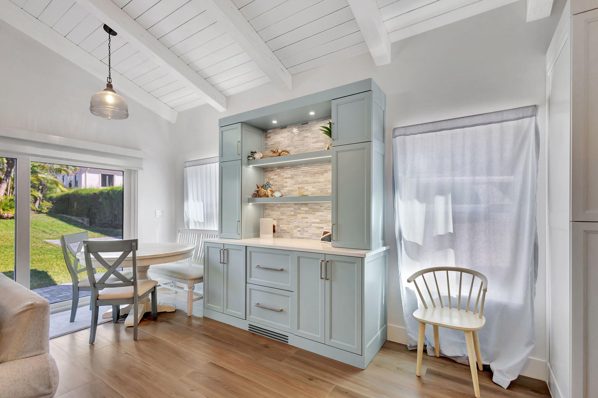 240 Celestial Way, Unit 5 Juno Beach, FL 33408 - Photo 6 of 41 a living room with furniture and a window