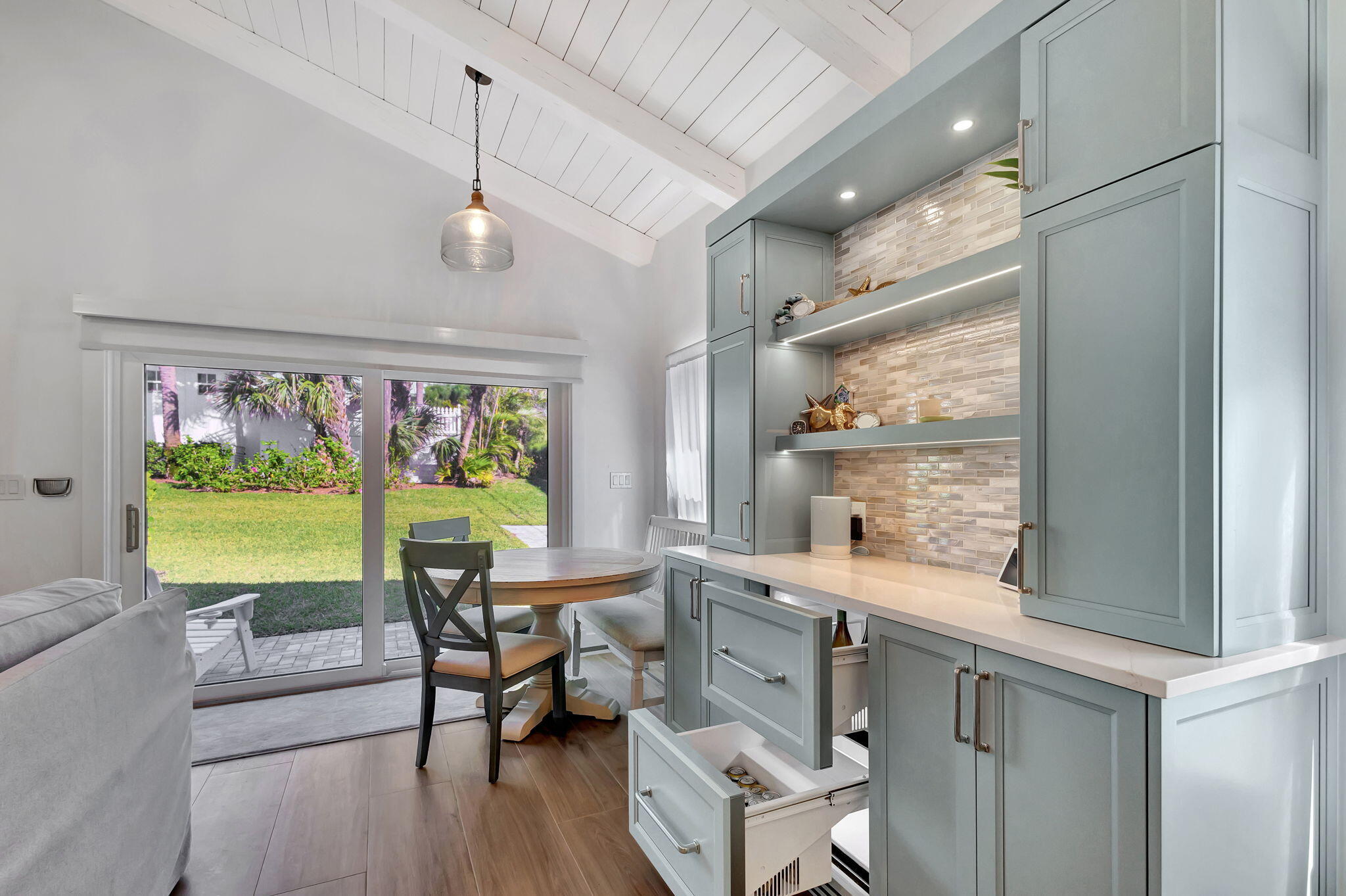 240 Celestial Way, Unit 5 Juno Beach, FL 33408 - Photo 7 of 41 a room with furniture and a large window