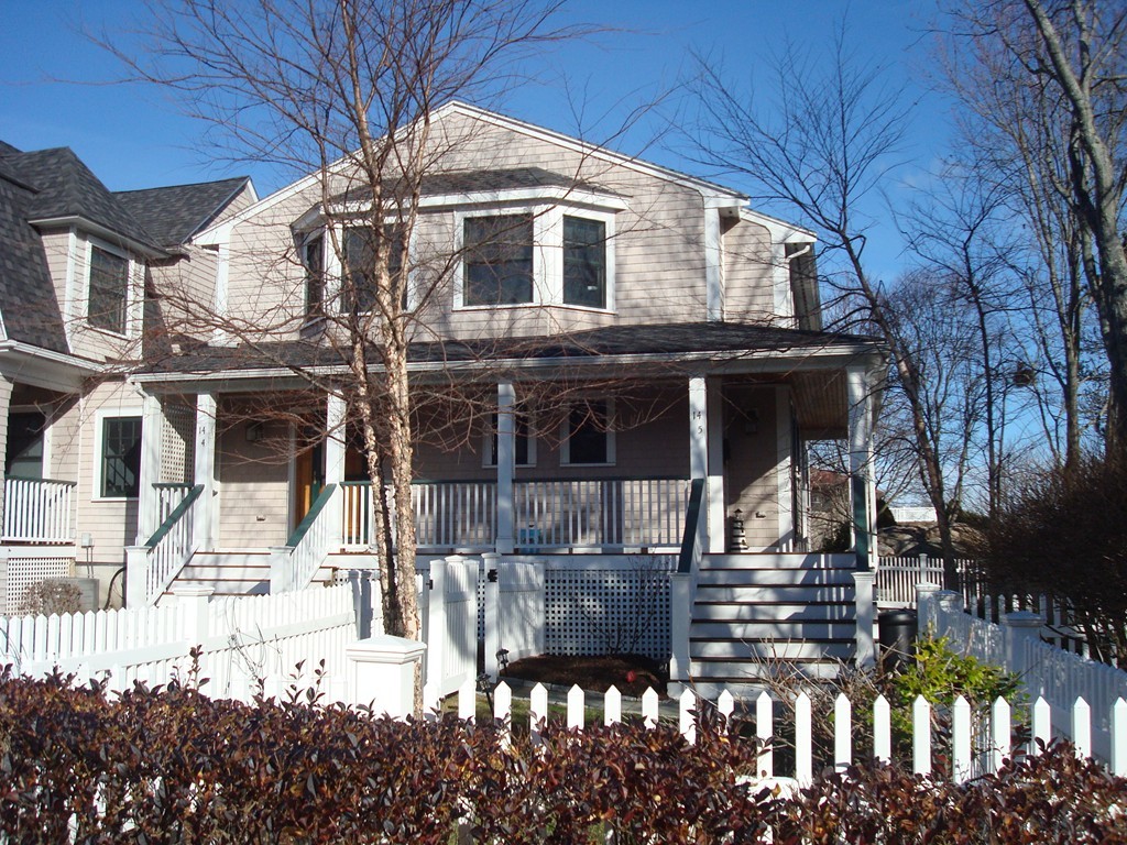14 Atlantic Road, Unit 5 Gloucester, MA 01930 - Photo 11 of 17 a front view of a house with glass windows