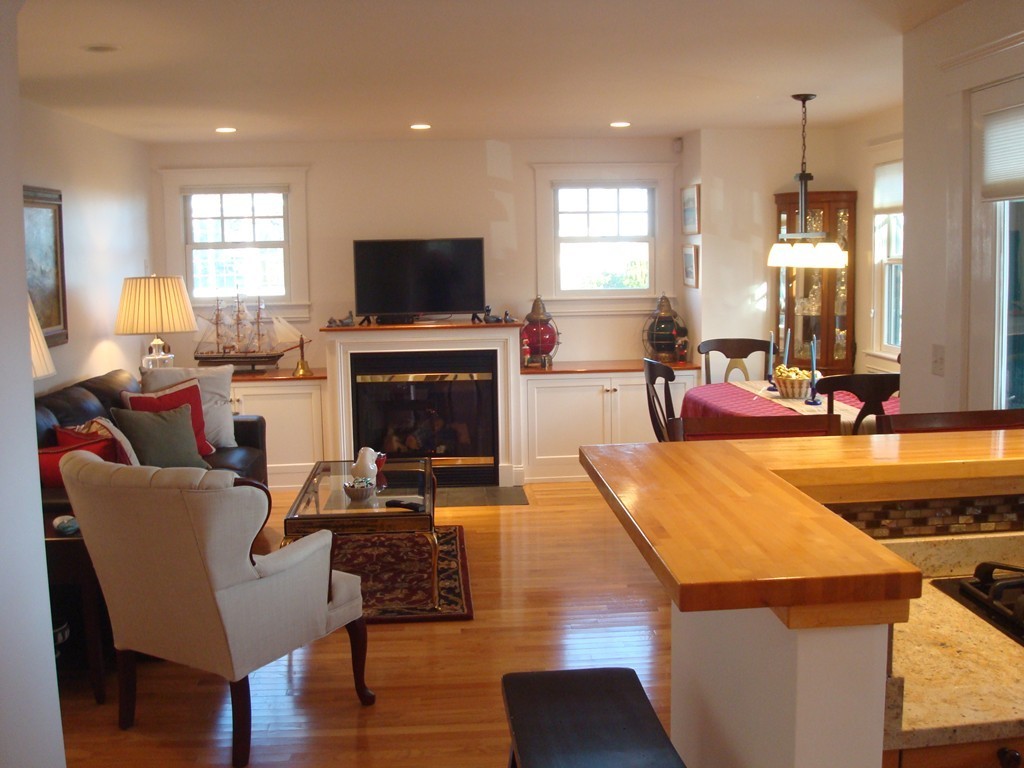 14 Atlantic Road, Unit 5 Gloucester, MA 01930 - Photo 4 of 17 a living room with fireplace furniture and a flat screen tv