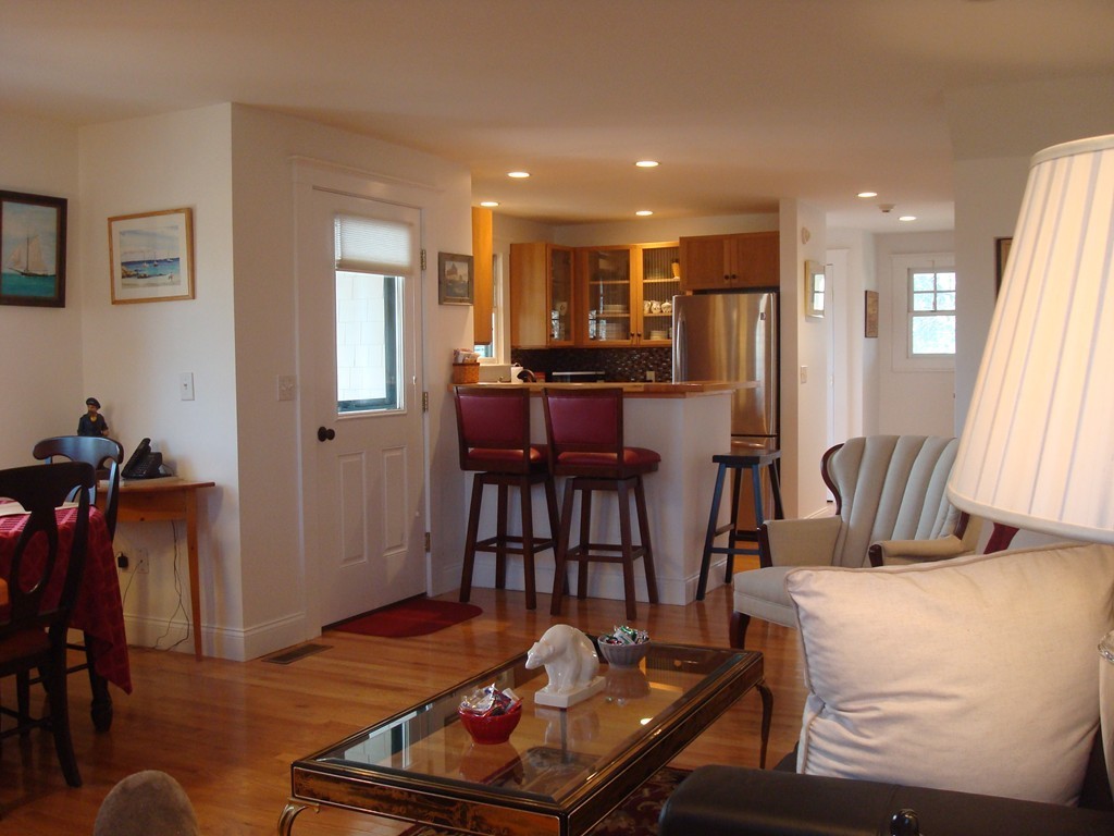 14 Atlantic Road, Unit 5 Gloucester, MA 01930 - Photo 5 of 17 a living room with furniture a table and wooden floor