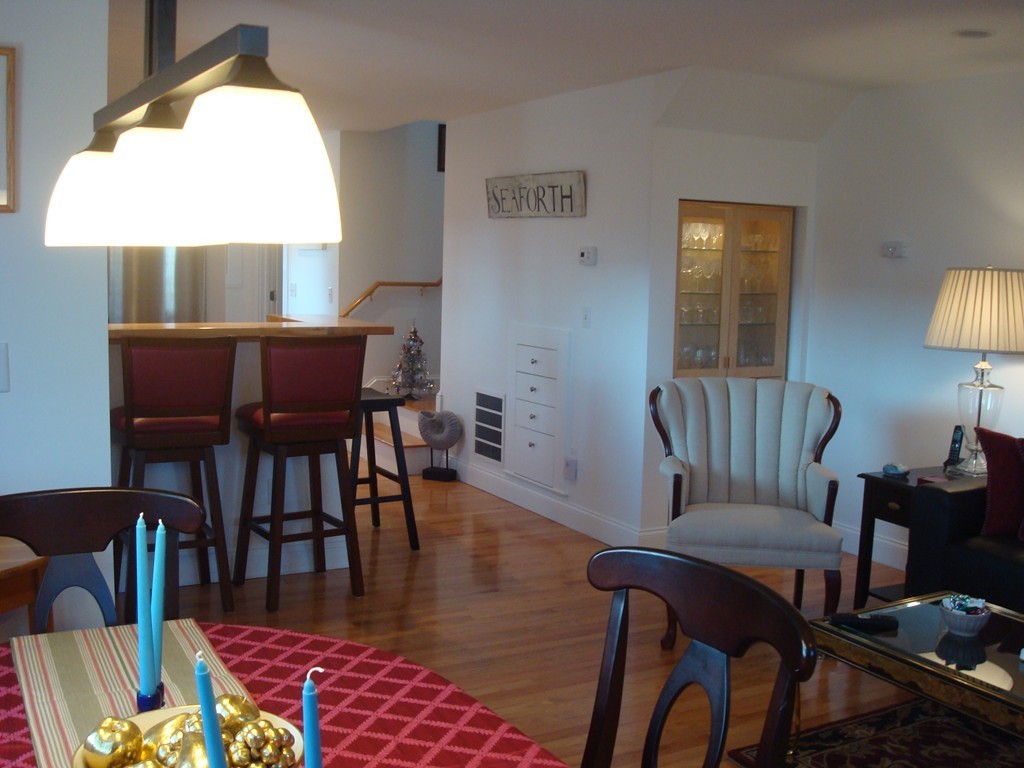 14 Atlantic Road, Unit 5 Gloucester, MA 01930 - Photo 6 of 17 a view of a dining room with furniture and wooden floor