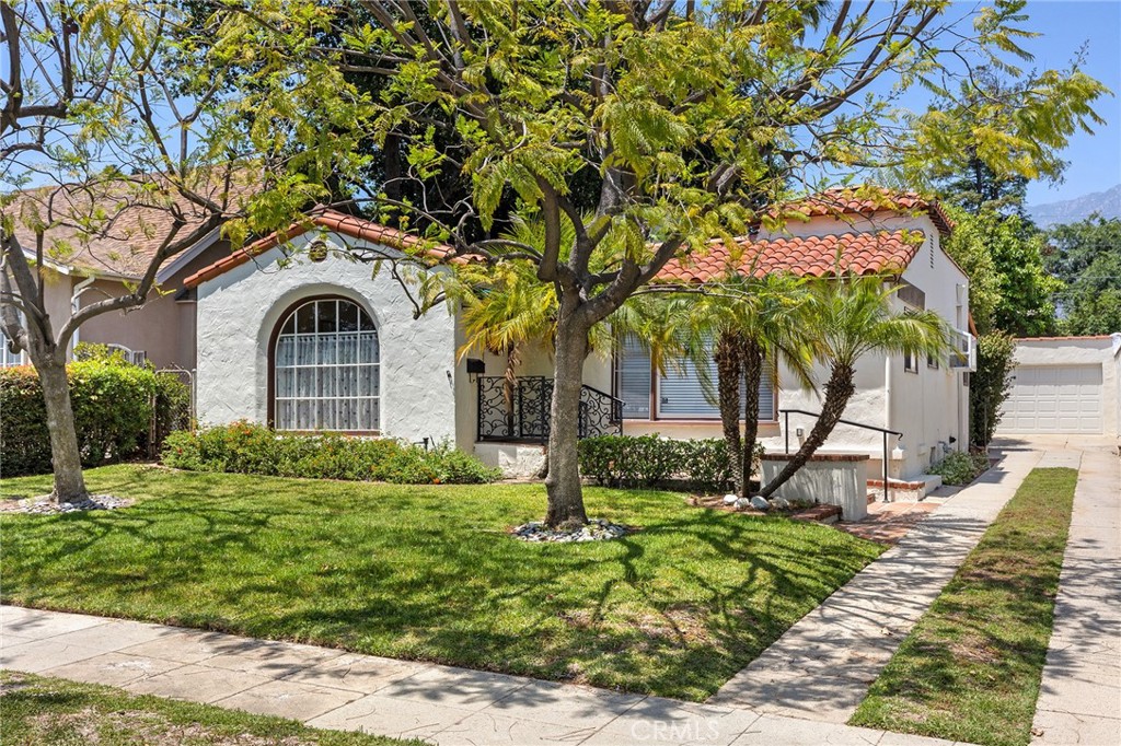 a front view of a house with garden