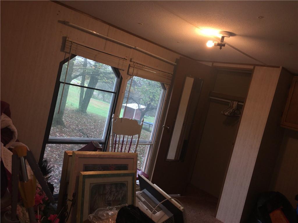 417 Red Mill Road Kittanning, PA 16201 - Photo 16 of 18 a view of a hallway with wooden floor and door