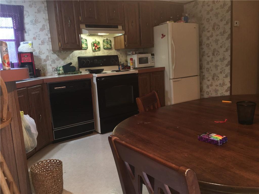 417 Red Mill Road Kittanning, PA 16201 - Photo 10 of 18 a kitchen with a refrigerator and a stove