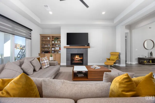 a kitchen with stainless steel appliances kitchen island granite countertop a table and chairs