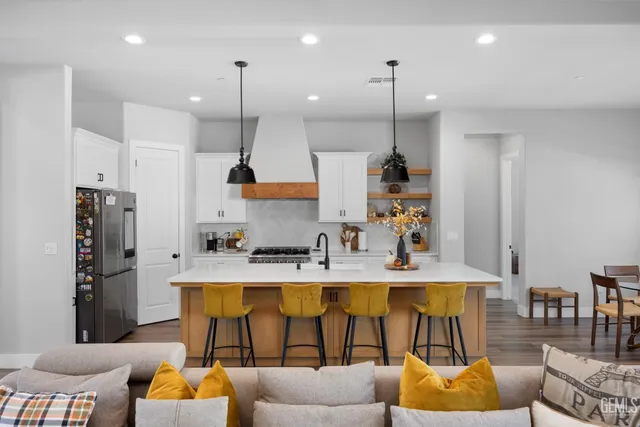 a kitchen with a sink a stove and cabinets