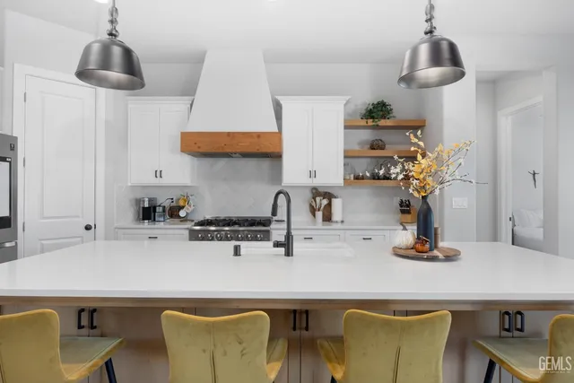 a bathroom with a sink toilet and a mirror