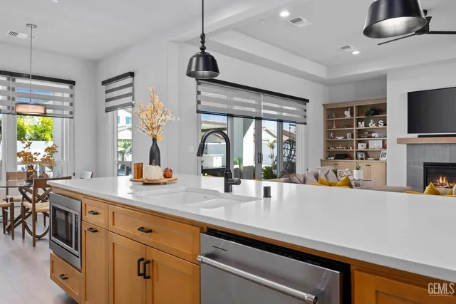 a spacious bathroom with a granite countertop sink mirror and bathtub